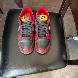 Nike Men’s Black & Red Low-Top Sneakers with Yellow Tongue Tag
